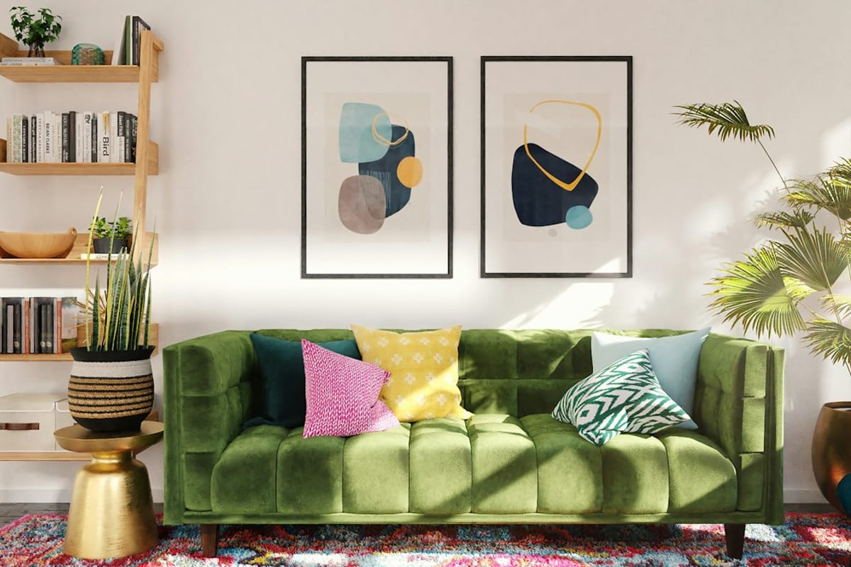 Green sofa with patterned throw pillows