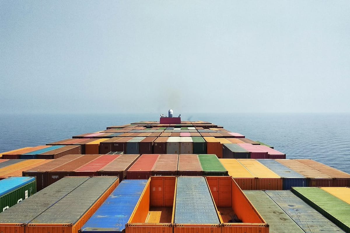 Container ship loaded with cargo at sea