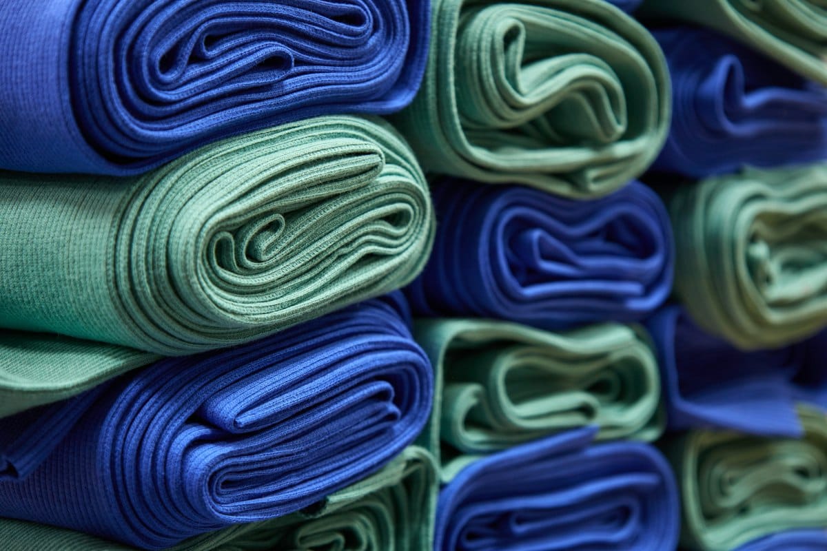 Stack of folded blue and green cloths